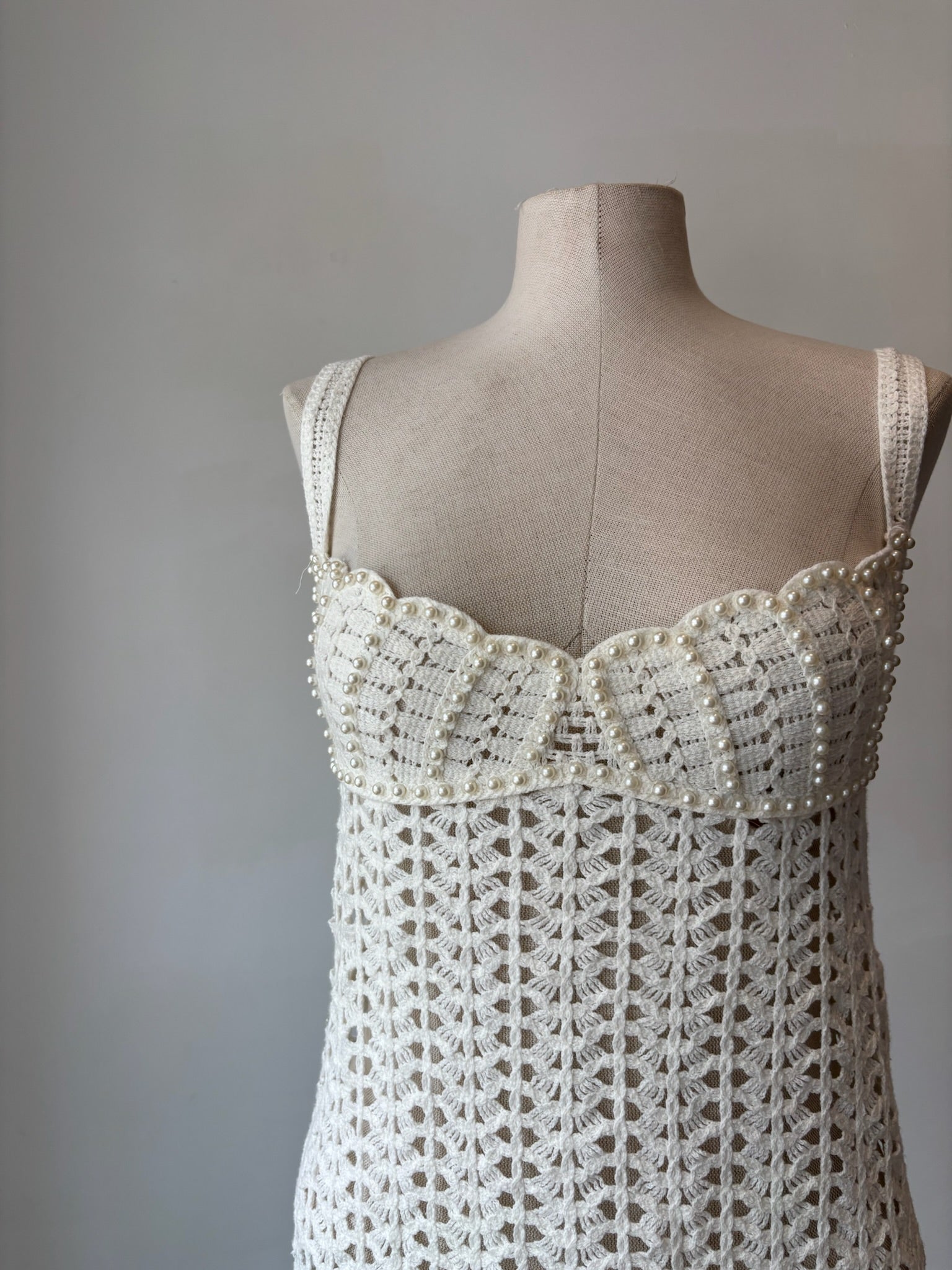 Unmarked white crochet mini dress with pearls detail, size Medium