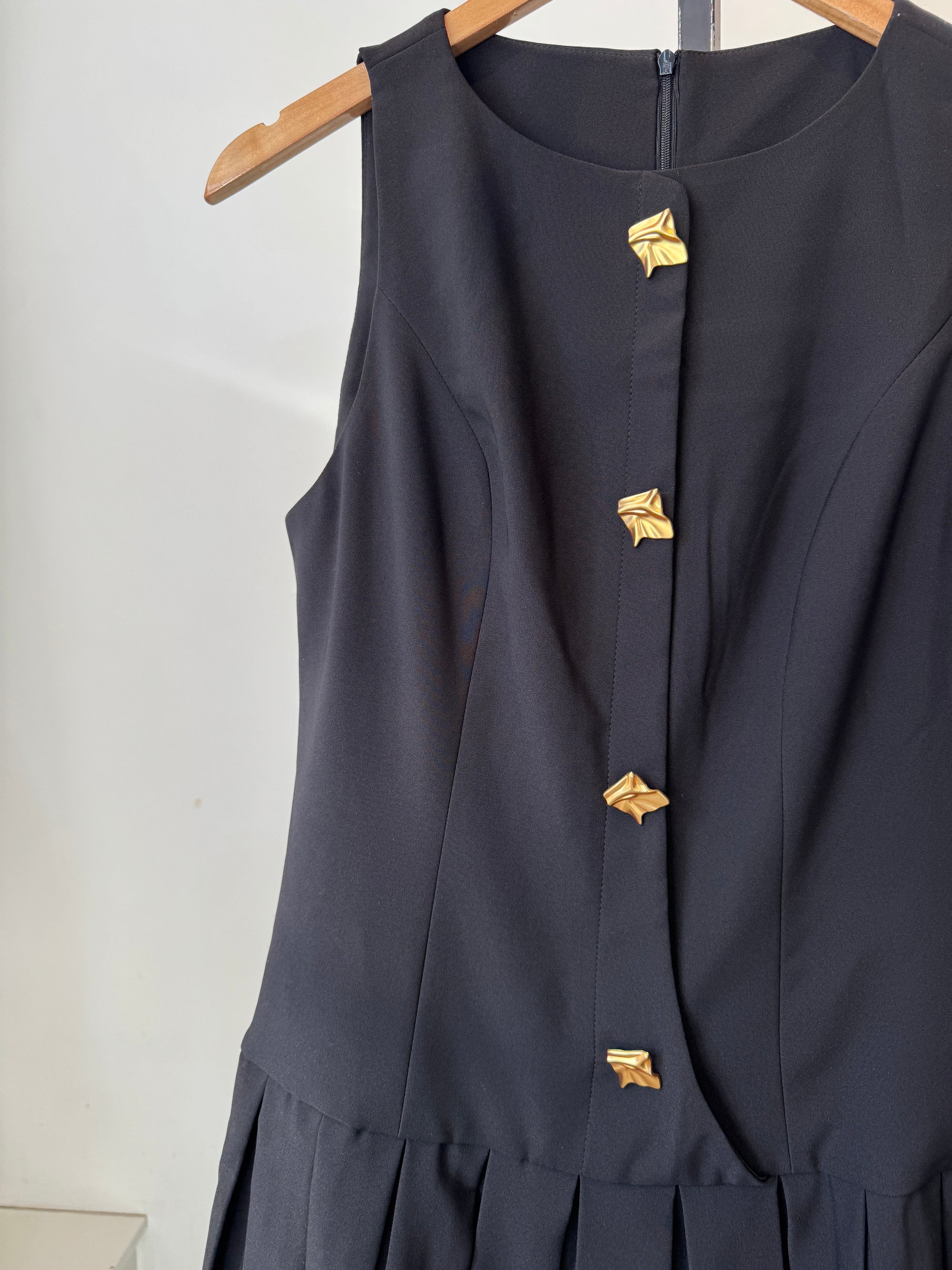 Commense Black Sleeveless Mini Dress with Pleated Skirt and Gold Buttons, Large